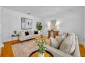 Cozy living room with comfortable seating, stylish decor, and a decorative area rug at 1068 Lake Baldwin Ln, Orlando, FL 32814