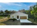 Charming single-Gathering home featuring a well-manicured lawn and a two-car garage at 170 Blaine St, Eustis, FL 32726