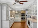 Kitchen features white cabinets and stainless steel appliances at 1710 Alvarado Ct, Longwood, FL 32779