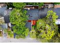 Well-maintained roof and mature landscaping is seen from above in this community at 207 Sweet Gum Way, Longwood, FL 32779