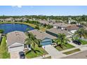 Beautiful aerial view of homes near a large lake, showcasing the neighborhood's serene environment and proximity to nature at 2907 Sime St, New Smyrna Beach, FL 32168