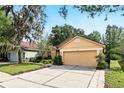 Lovely single-story home with well-kept lawn and a spacious driveway at 2987 Sabel Oak Pl, Oviedo, FL 32765