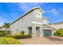 Charming house with a stone-accented two-car garage, side yard, and well-maintained landscaping at 321 Falls Dr, Kissimmee, FL 34747
