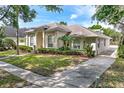 Attractive home with a neatly landscaped yard, a long driveway, and a well-maintained exterior at 418 Curry Ct, Altamonte Springs, FL 32714