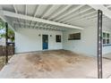 Spacious carport area with a white ceiling, offering covered parking at 4415 Gilpin Way, Orlando, FL 32812