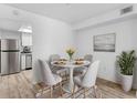 Cozy dining area featuring modern table, stylish seating, and adjacent updated kitchen at 500 Newell Hill Rd # 113A, Leesburg, FL 34748