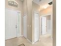 Inviting foyer featuring tile flooring and neutral paint, leading to other areas of the home at 558 Knollwood Dr, Davenport, FL 33837