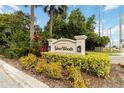 Silver Woods neighborhood sign surrounded by lush landscaping, indicating a well-maintained community at 9338 Palm Tree Dr, Windermere, FL 34786