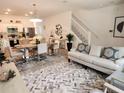 Inviting open-concept living space with a well-appointed kitchen, dining area, and living room for a modern lifestyle at 3020 Water Sprite St, Orlando, FL 32808