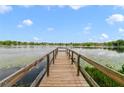 Picturesque waterfront views from a private dock with lily pads floating on the lake at 3225 Hargill Dr, Orlando, FL 32806