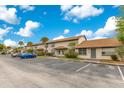 A condo community with ample parking and lush greenery at 5763 Saint Christopher Dr # 55, Orlando, FL 32822