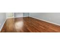 Living Room boasts beautiful wood floors and fresh paint at 610 Cranes Way # 207, Altamonte Springs, FL 32701