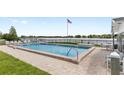 Outdoor pool area overlooking the lake provides a relaxing and scenic amenity for residents at 1550 11Th Ne St # H-4, Winter Haven, FL 33881