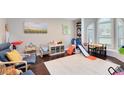 Bright playroom featuring a hardwood floor, large windows and toys at 1682 Wingspan Way, Winter Springs, FL 32708