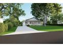 Inviting one-story home with a beautifully landscaped front yard and a long driveway at 1727 Barrow St, Deltona, FL 32725