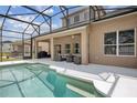 Screened in pool and patio with outdoor seating and lush landscaping at 1825 Saffron Plum Ln, Orlando, FL 32828