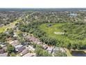 Expansive aerial view showcasing the lush greenery and nature surrounding the home in the community at 271 Morning Glory Dr, Lake Mary, FL 32746