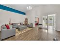 Spacious living area with modern decor and access to outdoor patio at 280 Bay St, Apopka, FL 32712