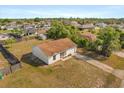 Quaint single-Gathering home with a one car garage and a large front yard in a residential neighborhood at 3166 Canby Dr, Deltona, FL 32738