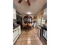 Traditional eat-in kitchen with tile flooring, glass door and dining table at 3219 Chariot Pl, Orlando, FL 32818