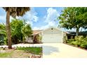 Charming single-Gathering home with a two-car garage and a beautifully landscaped front yard at 329 Kantor Blvd, Casselberry, FL 32707