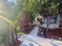 Charming walkway leading to the front door, surrounded by lush landscaping and a cozy, inviting atmosphere at 329 Kantor Blvd, Casselberry, FL 32707
