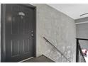 Close up of the entrance door of unit 4713-D in a condo building with exterior stairwell at 4713 S Texas Ave # 4713D, Orlando, FL 32839