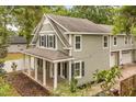 Two-story home boasting a charming front porch with white columns and a brick-paved walkway at 730 Cordova Dr, Orlando, FL 32804