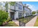 Row of well-maintained townhomes with consistent design, landscaping, and walkways, showcasing community appeal at 1010 Lychee Ct, Lake Mary, FL 32746