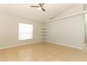 Inviting bedroom featuring tile floors, a ceiling fan, and natural light at 1040 Hamlet Dr, Maitland, FL 32751