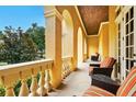 Inviting covered patio with comfortable seating and views of the surrounding landscape at 11055 Ullswater Ln, Windermere, FL 34786