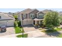 Beautiful home features a two-car garage, manicured lawn and established landscaping in a desirable neighborhood at 12048 Imaginary Way, Orlando, FL 32832
