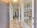 Inviting entryway featuring wood-look tile flooring and an open view into the spacious living areas at 157 Long Pine Dr, Deltona, FL 32725