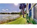 Enjoy picturesque water views and lush landscaping, creating a tranquil atmosphere near the condo at 408 E Orlando Ave # 2A, Ocoee, FL 34761