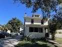 Charming two-story building with ample parking and mature trees at 415 N Fern Creek Ave, Orlando, FL 32803