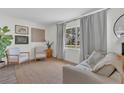 Bright and airy living room with neutral decor, a large window, and comfortable seating at 4636 Mesa Verde Dr, St Cloud, FL 34769