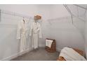 Spacious walk-in closet with ample shelving for organized storage at 5333 Spoonflower Ct, St Cloud, FL 34771