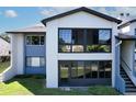 Condo exterior with large windows offering views of the lush surroundings and plenty of natural light at 6 Escondido Cir # 64, Altamonte Springs, FL 32701