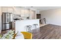 Modern kitchen with stainless steel appliances, white cabinets, and breakfast bar with seating at 1561 Corkery Ct, Winter Springs, FL 32708