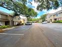 A view of the parking lot with a well maintained complex in the background at 255 Sandlewood Trl, Winter Park, FL 32789