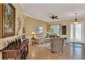 Comfortable living room with neutral tones, stylish decor, and ample natural light at 313 Sorrento Rd, Poinciana, FL 34759