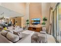 Open-concept living area boasts a spacious layout, modern decor, and plenty of natural light at 3228 Brasilia Ave, Kissimmee, FL 34747