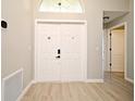 Inviting entryway features a double front door, complemented by stylish flooring at 4404 Gwyndale Ct, Orlando, FL 32837