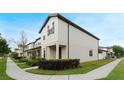 This townhome boasts stylish architecture and lush landscaping for curb appeal at 5089 Caspian St, St Cloud, FL 34771