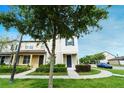 Attractive townhome with lovely front yard landscaping and well-maintained exterior at 5089 Caspian St, St Cloud, FL 34771