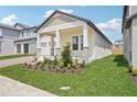 Beautiful single-Gathering home featuring a covered front porch and meticulously landscaped front yard at 5290 Citrus Leaf Blvd, Winter Garden, FL 34787