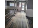 View of living room featuring wood-look floors and new paint and baseboards at 811 Fairview Ave, Altamonte Springs, FL 32701