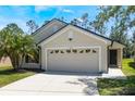 Charming single-Gathering home with a well-maintained lawn, two-car garage, and a welcoming entryway at 1920 Commander Way, Kissimmee, FL 34746
