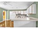 Bright kitchen with modern appliances and a convenient breakfast bar for casual dining at 247 S Marydell Ave, Deland, FL 32720