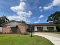 Charming single-story home with well-manicured lawn and inviting curb appeal at 3131 Lowndes Dr, Winter Park, FL 32792
